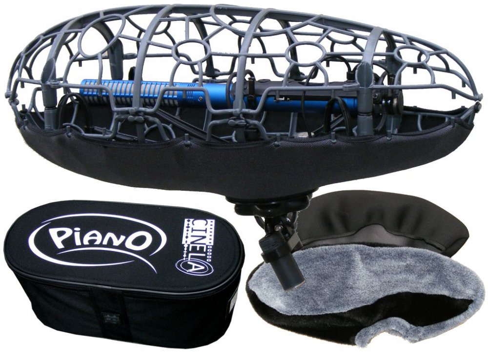 Blue microphone mounted in black metal shock mount with black soft case and gray furry windscreen.