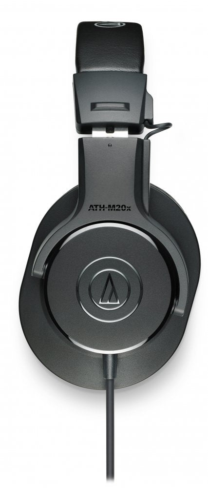 Black over-ear headphones with Audio-Technica logo and wired cable on white background.