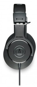 Black over-ear headphones with Audio-Technica logo and wired cable on white background.