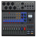 Top view of a Zoom LiveTrak L-8 mixer with multiple input jacks, knobs, faders, buttons, and a small display screen.