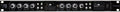 Front panel of a black T-Komp audio device with knobs, switches, and VU meters on a rack-mountable unit.