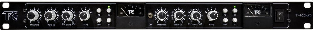Front panel of a black T-Komp audio device with knobs, switches, and VU meters on a rack-mountable unit.