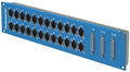 Blue metal patchbay panel with 24 XLR connectors and 3 D-sub connectors labeled 1-8, 9-16, and 17-24