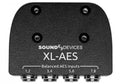 Black metal audio device panel with four balanced AES input connectors labeled 1-8.