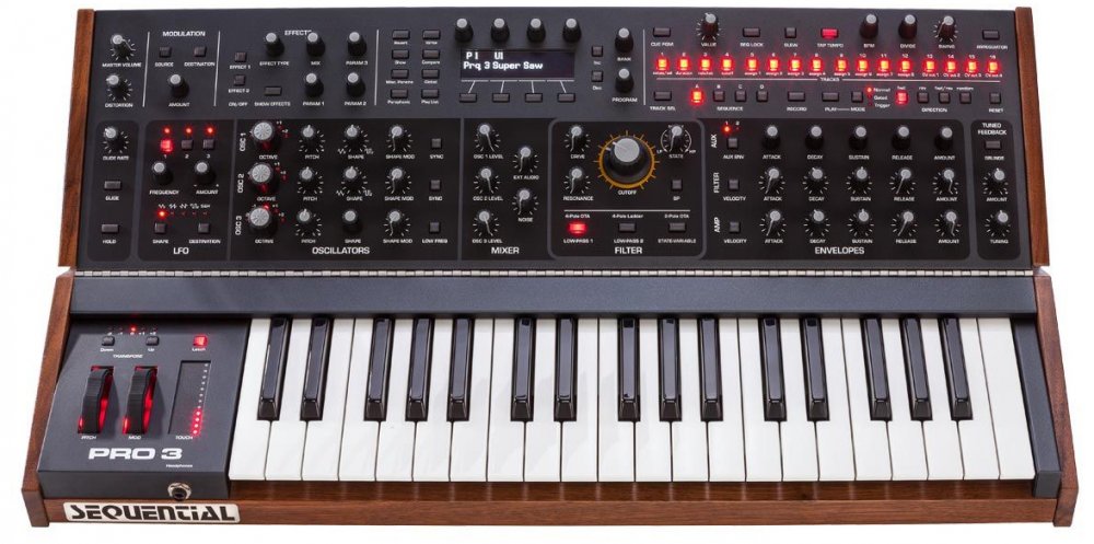 Analog synthesizer keyboard with modulation controls, oscillator section, filter, envelopes, and multiple illuminated buttons and knobs.