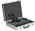 Open silver case with foam interior containing two black and gold handheld microphones, two clips, and a coiled cable.