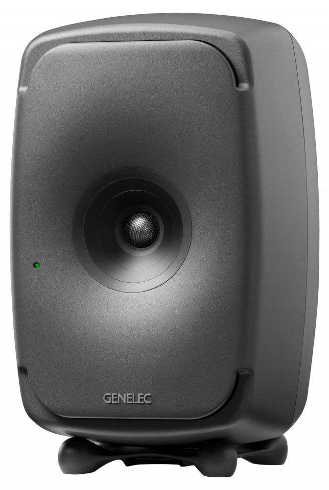 Black Genelec studio monitor speaker shown from the front with a central driver and small green indicator light.