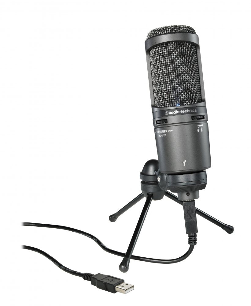 Black USB microphone mounted on a small tripod stand with USB cable connected