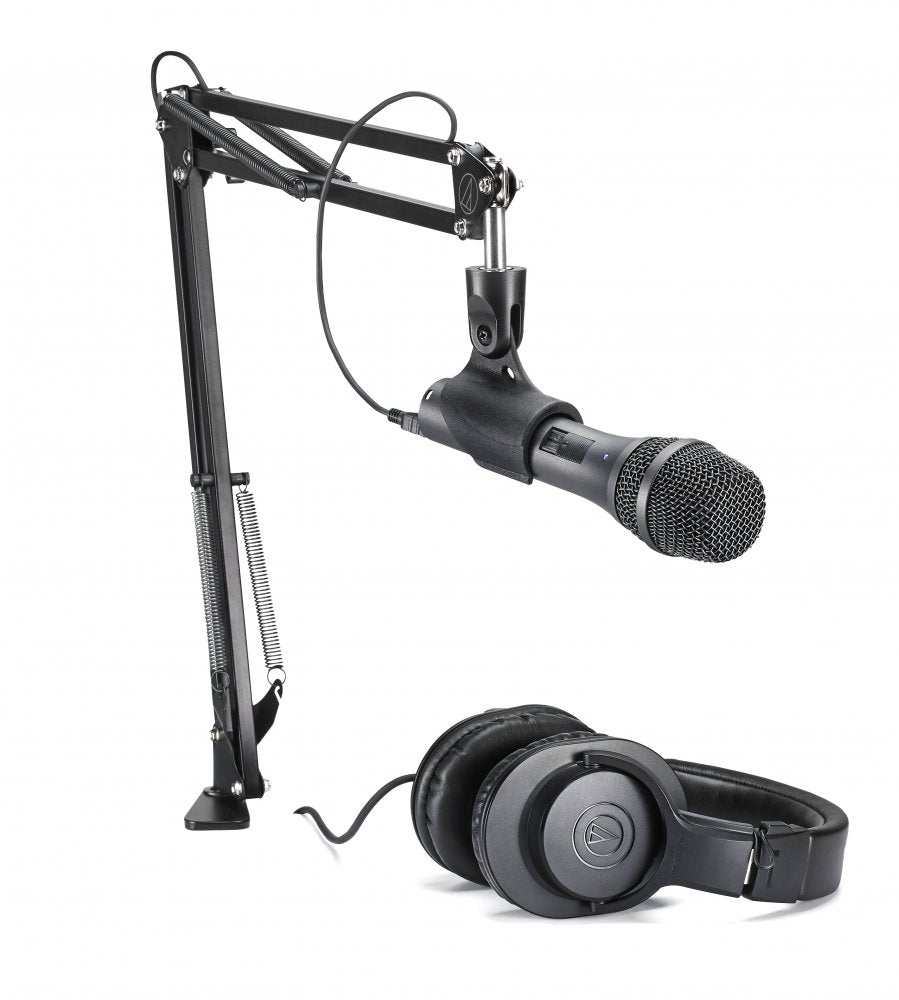 Black studio microphone on adjustable arm stand paired with over-ear headphones.