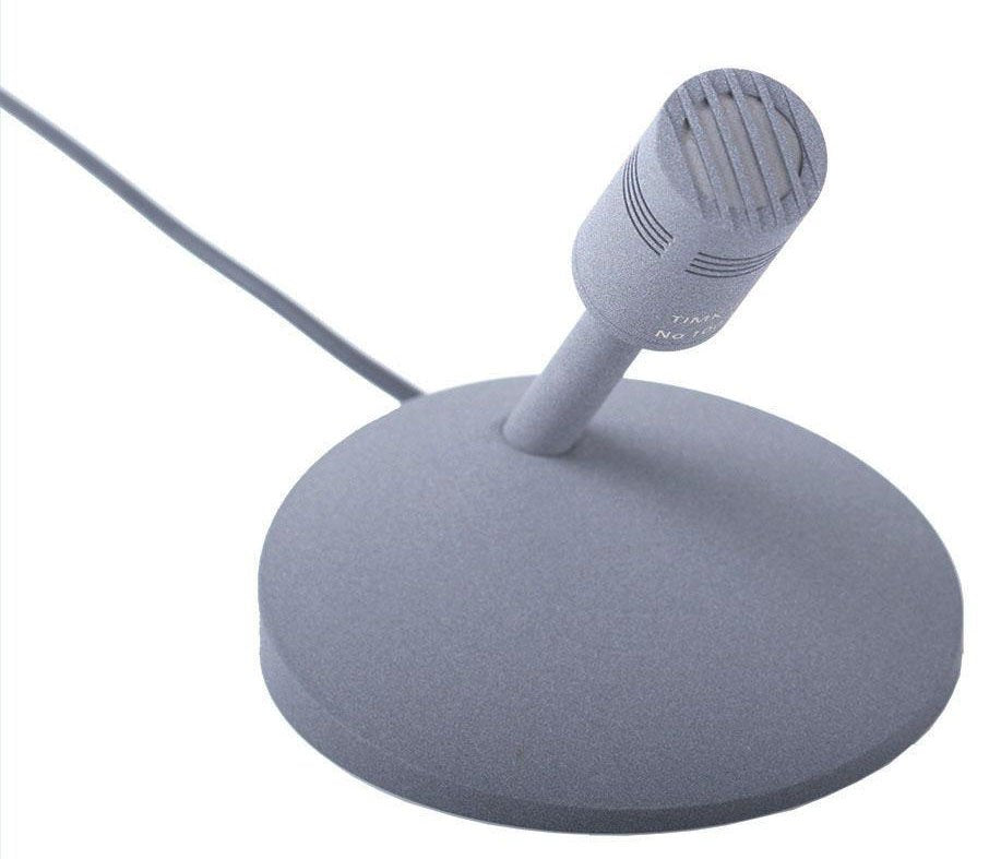 Gray tabletop microphone mounted on a round base with an attached cable.
