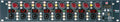 Black 8-channel audio preamp with red knobs, combo jack inputs, and multiple control buttons and indicators.
