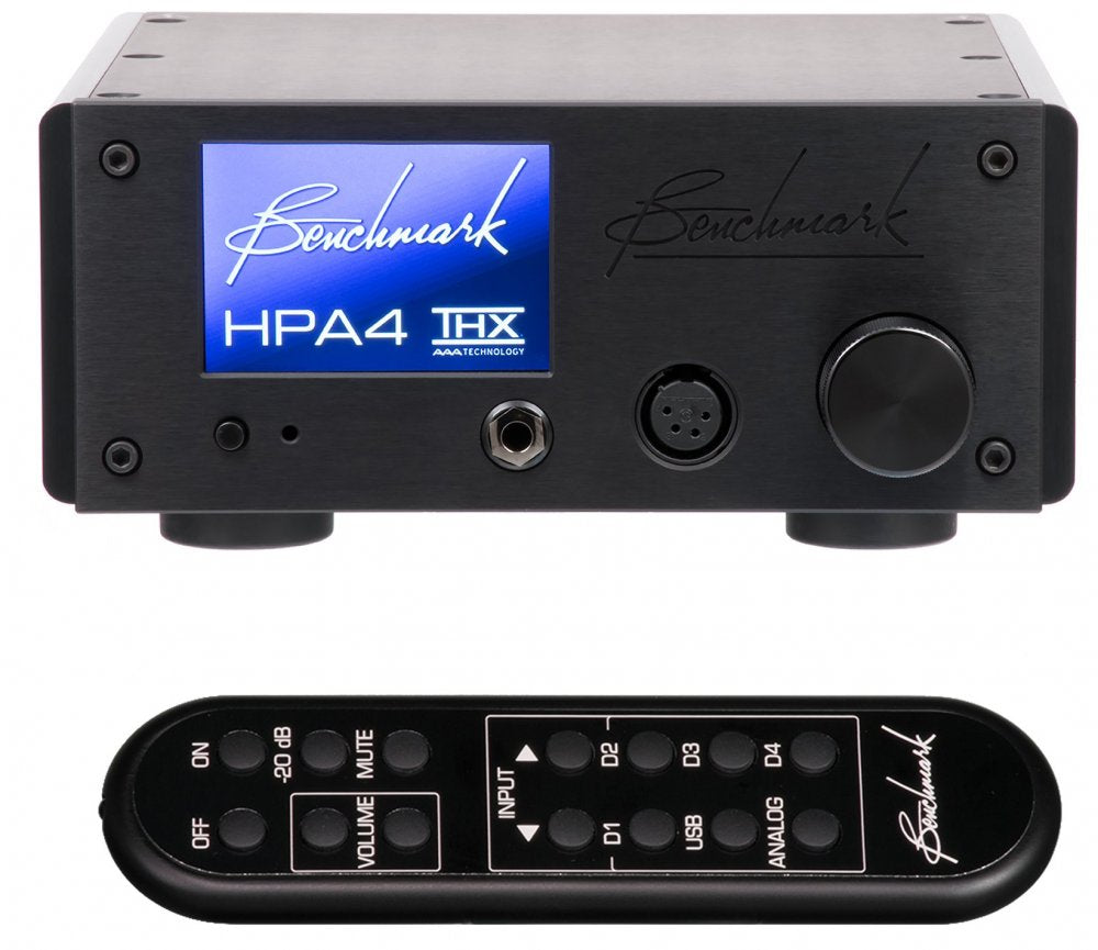 Black Benchmark HPA4 headphone amplifier with display and a black remote control with multiple buttons.