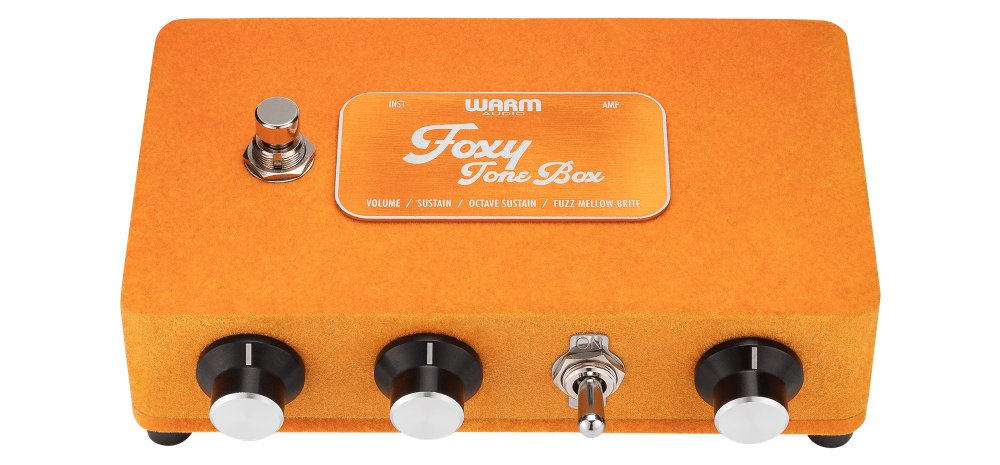Orange guitar effects pedal with three black knobs, one toggle switch, and one footswitch labeled Foxy Tone Box.