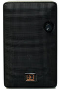 Black rectangular electronic device with textured front, rotary knob, and REMOTE AUDIO logo.