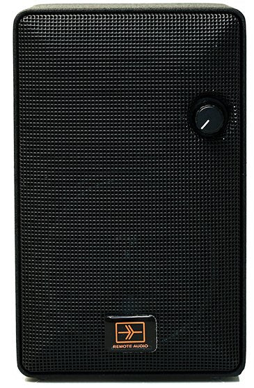 Black rectangular electronic device with textured front, rotary knob, and REMOTE AUDIO logo.