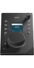 Black remote control device with buttons, rotary dials, and a small screen showing network and volume info.
