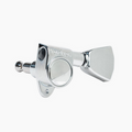 Single chrome guitar tuning machine with mounting holes and tuning peg visible.