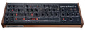 Top view of a Sequential Prophet-5 synthesizer desktop module with knobs, buttons, and wood side panels.
