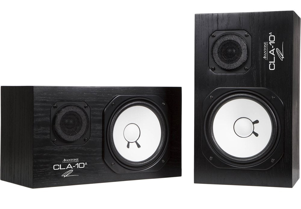Pair of black studio monitor speakers with white cones, one shown horizontally and the other vertically.