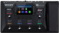 Top view of a ZOOM G6 multi-effects processor for guitar with display, footswitches, knobs, and expression pedal.