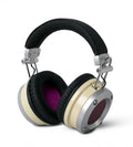 Over-ear headphones with black padded headband, cream-colored ear cups, and purple fabric inside ear cushions.