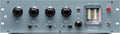 Front panel of a stereo equalizer with rotary knobs, two glowing tubes, toggle switches, and a power indicator light.