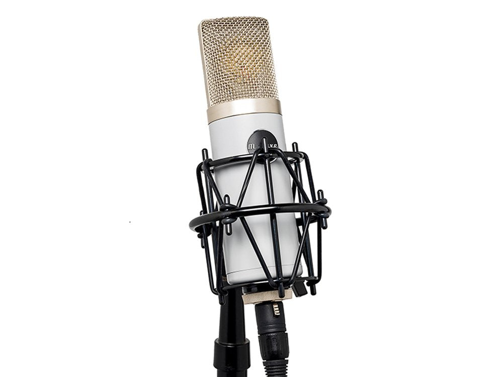 Silver condenser microphone with gold mesh grille mounted in black shock mount on stand.