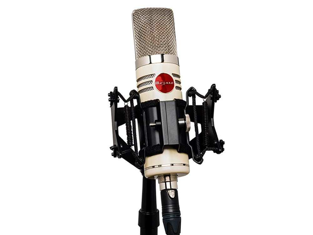 Cream-colored Mojave microphone with shock mount and XLR cable on a stand against a white background.