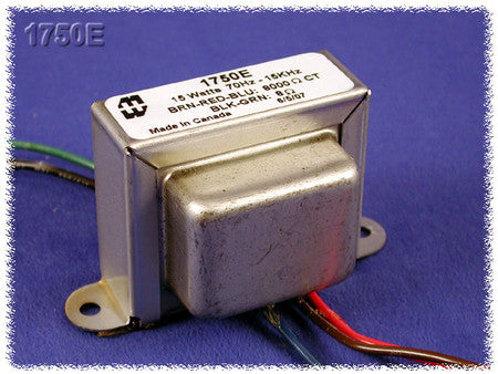 Metal output transformer with multiple colored insulated wire leads on a blue cloth background.