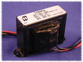 Black rectangular transformer with multiple colored wire leads and a white label showing technical specifications on top.