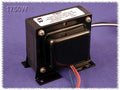 Black Hammond output transformer with multiple colored wire leads and mounting base on purple surface.