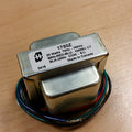Metal output transformer with multiple colored wire leads and specification label.