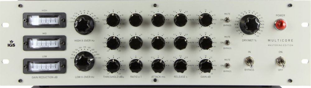 Front panel of an audio processing unit with multiple knobs, toggle switches, three analog meters, and power switch.