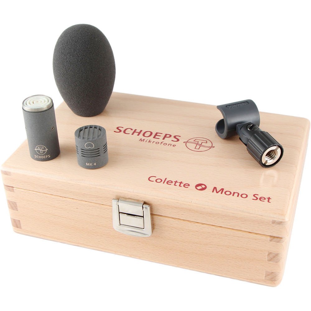 Microphone capsule, windscreen foam, clip, all placed on a wooden box labeled SCHOEPS Colette Mono Set.