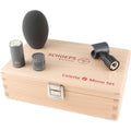 Microphone capsule, windscreen foam, clip, all placed on a wooden box labeled SCHOEPS Colette Mono Set.