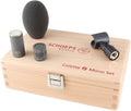 Microphone set including capsules, foam windshield, clip, displayed on a wooden box labeled Colette Mono Set