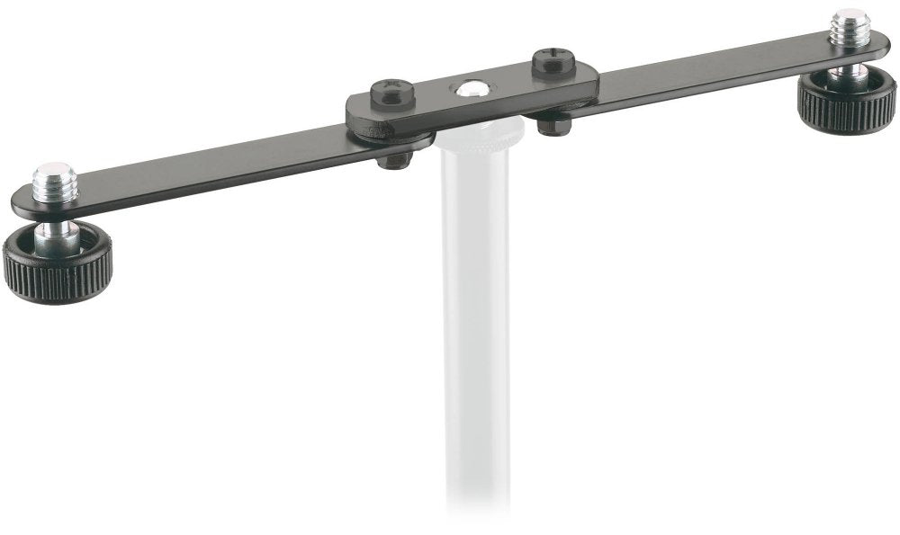 Black metal bar with screws and knobs mounted on a white stand.