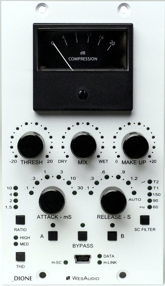Front panel of an audio compression processor with knobs, push buttons, a meter, and a central data port.