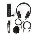 Black USB microphone with headphones, tripod stand, windshield foam, and cables laid out on a white background.