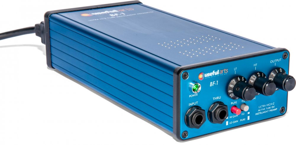 Blue metal audio preamp device with multiple knobs, switches, and two 1/4 inch input/output jacks on front panel.