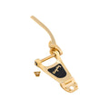 Gold-colored Bigsby vibrato tailpiece with four gold screws on a white background.