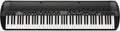Black and white electronic keyboard with multiple control knobs, push buttons, keypad, and KORG branding.