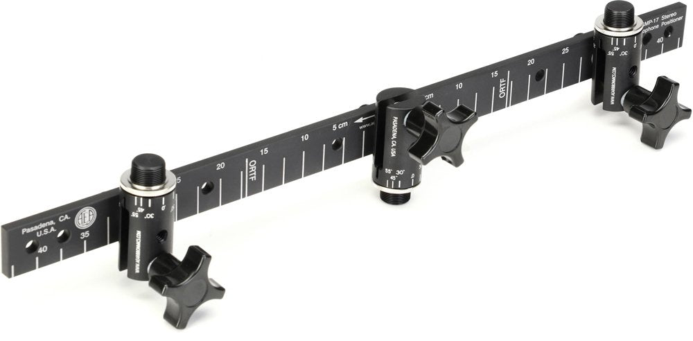 Black metal measurement bar with three adjustable clamp mounts featuring knobs and measurement markings.