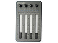 Top view of a Zaxcom audio mixer with four vertical faders, four knobs, and multiple small buttons and indicators.