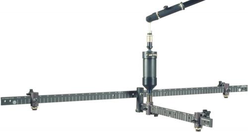 Black microphone mounted in a metal three-arm frame with adjustable clamps and a top-mounted microphone.