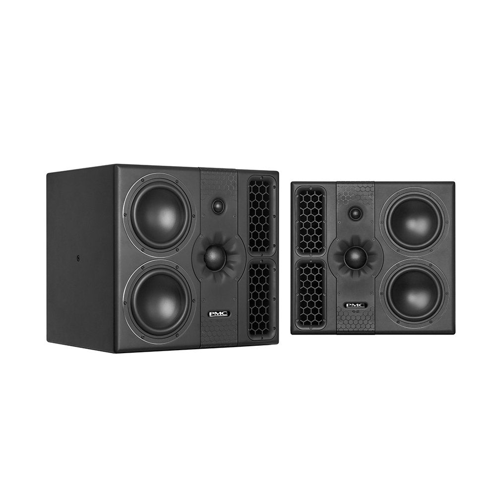 Two black PMC professional studio monitor speakers with dual woofers and ventilation grilles.