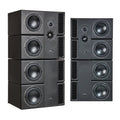 Four black studio monitors with PMC logo stacked on the left and three subwoofers stacked on the right.