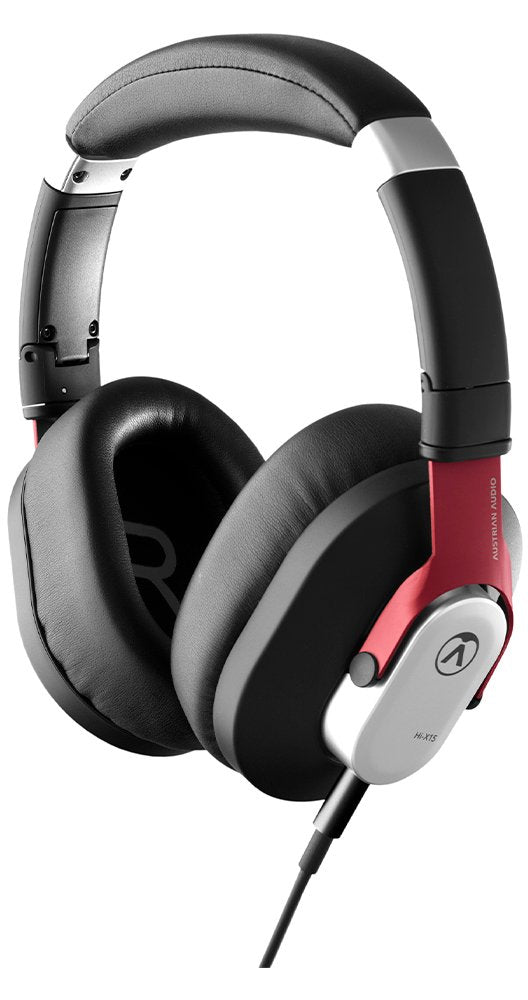 Black and red over-ear headphones with padded headband and wired connection.
