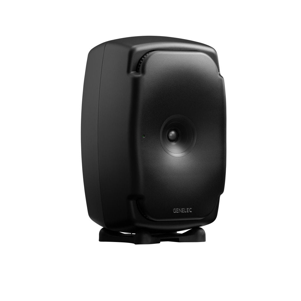 Black studio monitor speaker with curved edges and front driver mounted on a small isolation pad
