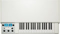 Top view of a white keyboard synthesizer with black and white keys and control panel with knobs and toggle switch.